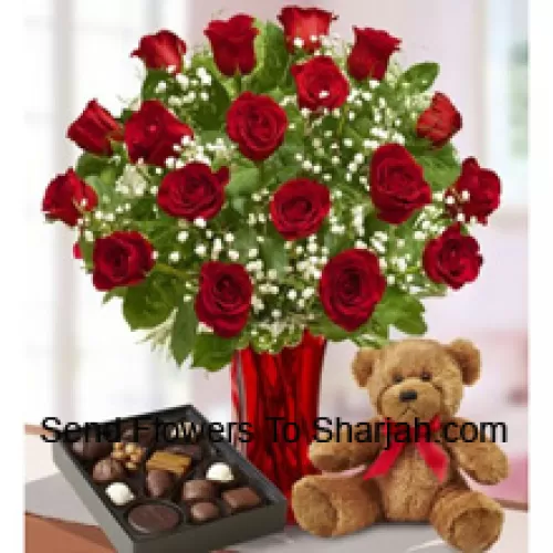 <b>Product Description</b><br><br>24 Red Roses With Some Ferns In A Glass Vase, A Cute Brown Teddy Bear And An Imported Box Of Chocolates<br><br><b>Delivery Information</b><br><br>* The design and packaging of the product can always vary and is subject to the availability of flowers and other products available at the time of delivery.<br><br>* The "Time selected is treated as a preference/request and is not a fixed time for delivery". We only guarantee delivery on a "Specified Date" and not within a specified "Time Frame".