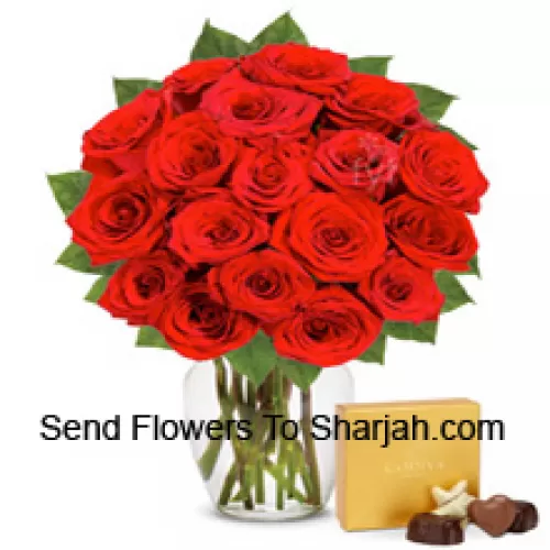 <b>Product Description</b><br><br>24 Red Roses With Some Ferns In A Glass Vase Accompanied With An Imported Box Of Chocolates<br><br><b>Delivery Information</b><br><br>* The design and packaging of the product can always vary and is subject to the availability of flowers and other products available at the time of delivery.<br><br>* The "Time selected is treated as a preference/request and is not a fixed time for delivery". We only guarantee delivery on a "Specified Date" and not within a specified "Time Frame".