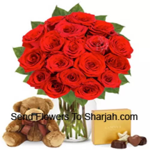 <b>Product Description</b><br><br>12 Red Roses With Some Ferns In A Glass Vase Accompanied With An Imported Box Of Chocolates And A Cute 12 Inches Tall Brown Teddy Bear<br><br><b>Delivery Information</b><br><br>* The design and packaging of the product can always vary and is subject to the availability of flowers and other products available at the time of delivery.<br><br>* The "Time selected is treated as a preference/request and is not a fixed time for delivery". We only guarantee delivery on a "Specified Date" and not within a specified "Time Frame".