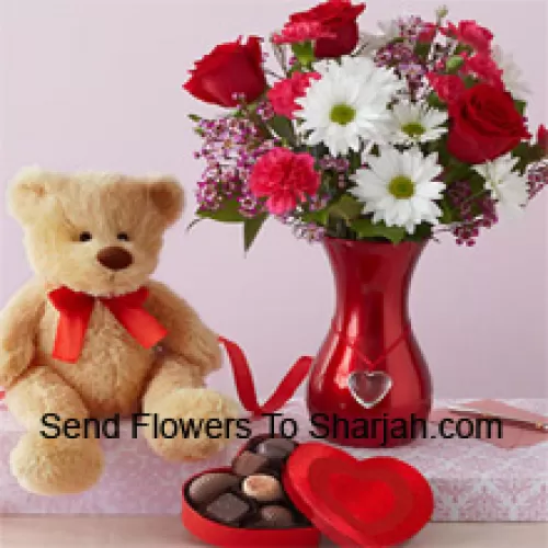 <b>Product Description</b><br><br>Red Roses And White Gerberas With Some Ferns In A Glass Vase Along With A Cute 12 Inches Tall Brown Teddy Bear And An Imported Box Of Chooclates<br><br><b>Delivery Information</b><br><br>* The design and packaging of the product can always vary and is subject to the availability of flowers and other products available at the time of delivery.<br><br>* The "Time selected is treated as a preference/request and is not a fixed time for delivery". We only guarantee delivery on a "Specified Date" and not within a specified "Time Frame".