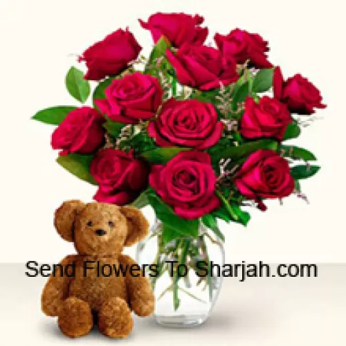 <b>Product Description</b><br><br>12 Red Roses With Some Ferns In A Glass Vase Along With A Cute 12 Inches Tall Brown Teddy Bear<br><br><b>Delivery Information</b><br><br>* The design and packaging of the product can always vary and is subject to the availability of flowers and other products available at the time of delivery.<br><br>* The "Time selected is treated as a preference/request and is not a fixed time for delivery". We only guarantee delivery on a "Specified Date" and not within a specified "Time Frame".
