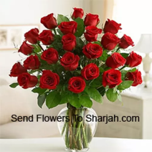 <b>Product Description</b><br><br>24 Red Roses With Some Ferns In A Glass Vase<br><br><b>Delivery Information</b><br><br>* The design and packaging of the product can always vary and is subject to the availability of flowers and other products available at the time of delivery.<br><br>* The "Time selected is treated as a preference/request and is not a fixed time for delivery". We only guarantee delivery on a "Specified Date" and not within a specified "Time Frame".