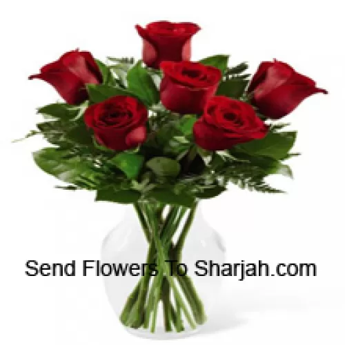 <b>Product Description</b><br><br>6 Red Roses With Some Ferns In A Glass Vase<br><br><b>Delivery Information</b><br><br>* The design and packaging of the product can always vary and is subject to the availability of flowers and other products available at the time of delivery.<br><br>* The "Time selected is treated as a preference/request and is not a fixed time for delivery". We only guarantee delivery on a "Specified Date" and not within a specified "Time Frame".