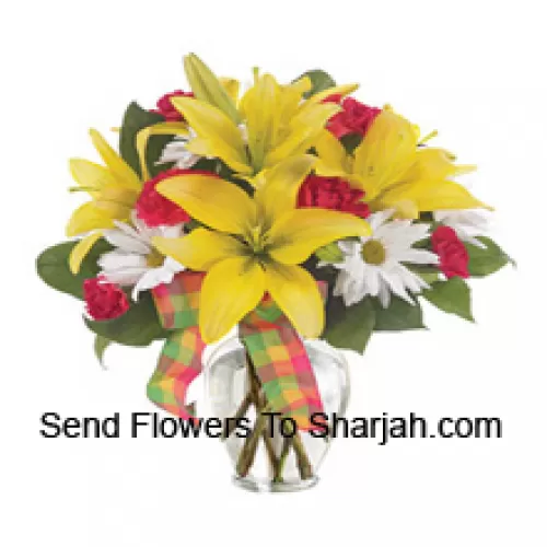 <b>Product Description</b><br><br>Yellow Lilies, Red Carnations And Suitable Seasonal White Flowers Arranged Beautifully In A Glass Vase<br><br><b>Delivery Information</b><br><br>* The design and packaging of the product can always vary and is subject to the availability of flowers and other products available at the time of delivery.<br><br>* The "Time selected is treated as a preference/request and is not a fixed time for delivery". We only guarantee delivery on a "Specified Date" and not within a specified "Time Frame".