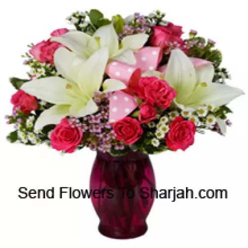 <b>Product Description</b><br><br>Pink Roses And White Lilies With Seasonal Fillers In A Glass Vase<br><br><b>Delivery Information</b><br><br>* The design and packaging of the product can always vary and is subject to the availability of flowers and other products available at the time of delivery.<br><br>* The "Time selected is treated as a preference/request and is not a fixed time for delivery". We only guarantee delivery on a "Specified Date" and not within a specified "Time Frame".