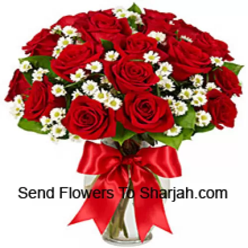 <b>Product Description</b><br><br>24 Red Roses With Some Ferns In A Glass Vase<br><br><b>Delivery Information</b><br><br>* The design and packaging of the product can always vary and is subject to the availability of flowers and other products available at the time of delivery.<br><br>* The "Time selected is treated as a preference/request and is not a fixed time for delivery". We only guarantee delivery on a "Specified Date" and not within a specified "Time Frame".