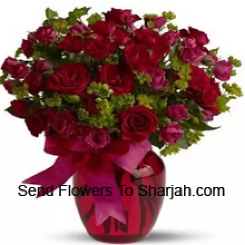<b>Product Description</b><br><br>25 Red And 25 Pink Roses With Some Ferns In A Glass Vase<br><br><b>Delivery Information</b><br><br>* The design and packaging of the product can always vary and is subject to the availability of flowers and other products available at the time of delivery.<br><br>* The "Time selected is treated as a preference/request and is not a fixed time for delivery". We only guarantee delivery on a "Specified Date" and not within a specified "Time Frame".