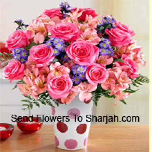 <b>Product Description</b><br><br>Pink Roses, Pink Orchids And Assorted Purple Flowers Arranged Beautifully In A Glass Vase<br><br><b>Delivery Information</b><br><br>* The design and packaging of the product can always vary and is subject to the availability of flowers and other products available at the time of delivery.<br><br>* The "Time selected is treated as a preference/request and is not a fixed time for delivery". We only guarantee delivery on a "Specified Date" and not within a specified "Time Frame".
