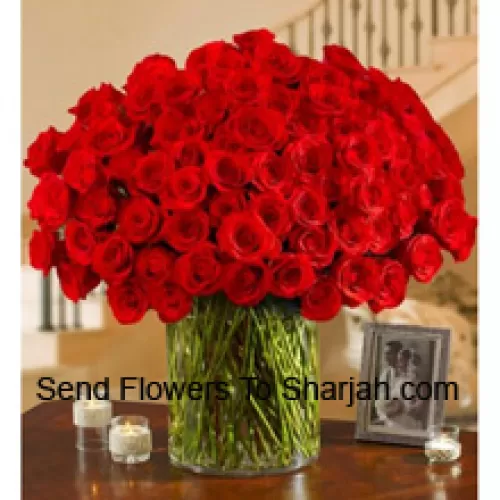 <b>Product Description</b><br><br>100 Red Roses With Some Ferns In A Big Glass Vase<br><br><b>Delivery Information</b><br><br>* The design and packaging of the product can always vary and is subject to the availability of flowers and other products available at the time of delivery.<br><br>* The "Time selected is treated as a preference/request and is not a fixed time for delivery". We only guarantee delivery on a "Specified Date" and not within a specified "Time Frame".