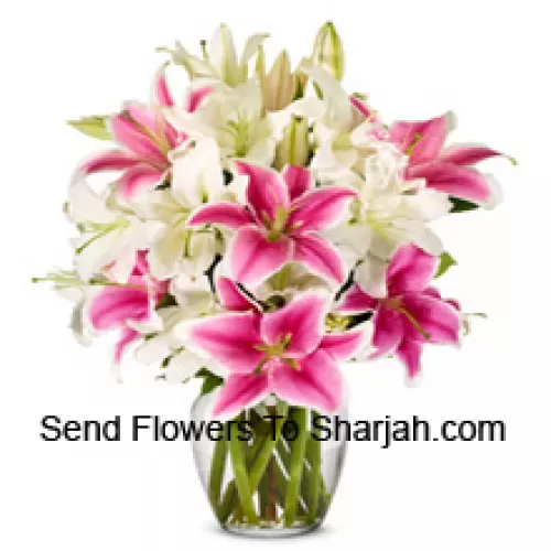<b>Product Description</b><br><br>White And Pink Lilies With Some Ferns In A Glass Vase<br><br><b>Delivery Information</b><br><br>* The design and packaging of the product can always vary and is subject to the availability of flowers and other products available at the time of delivery.<br><br>* The "Time selected is treated as a preference/request and is not a fixed time for delivery". We only guarantee delivery on a "Specified Date" and not within a specified "Time Frame".