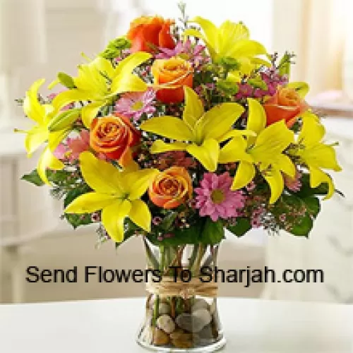 <b>Product Description</b><br><br>Yellow Lilies, Orange Roses And Pink Gerberas With Seasonal Fillers In A Glass Vase<br><br><b>Delivery Information</b><br><br>* The design and packaging of the product can always vary and is subject to the availability of flowers and other products available at the time of delivery.<br><br>* The "Time selected is treated as a preference/request and is not a fixed time for delivery". We only guarantee delivery on a "Specified Date" and not within a specified "Time Frame".