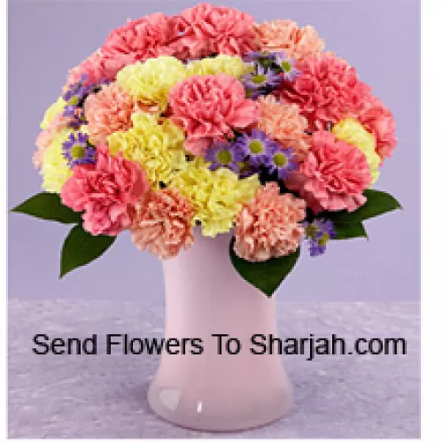 <b>Product Description</b><br><br>24 Mixed Colored Carnations With Seasonal Fillers In A Glass Vase<br><br><b>Delivery Information</b><br><br>* The design and packaging of the product can always vary and is subject to the availability of flowers and other products available at the time of delivery.<br><br>* The "Time selected is treated as a preference/request and is not a fixed time for delivery". We only guarantee delivery on a "Specified Date" and not within a specified "Time Frame".