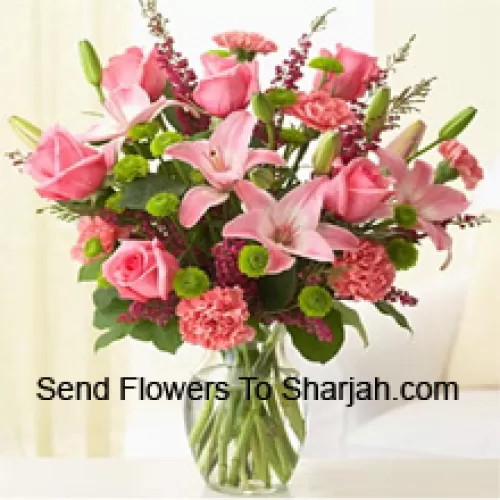 <b>Product Description</b><br><br>Pink Roses, Pink Carnations And Pink Lilies With Assorted Ferns And Fillers In A Glass Vase<br><br><b>Delivery Information</b><br><br>* The design and packaging of the product can always vary and is subject to the availability of flowers and other products available at the time of delivery.<br><br>* The "Time selected is treated as a preference/request and is not a fixed time for delivery". We only guarantee delivery on a "Specified Date" and not within a specified "Time Frame".