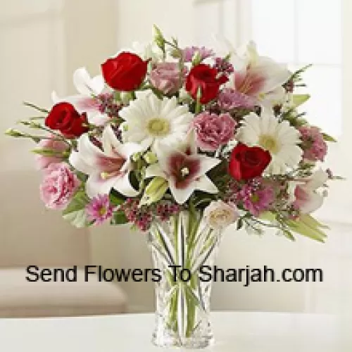 <b>Product Description</b><br><br>Red Roses, Pink Carnations White Gerberas And White Lilies With Other Assorted Flowers In A Glass Vase<br><br><b>Delivery Information</b><br><br>* The design and packaging of the product can always vary and is subject to the availability of flowers and other products available at the time of delivery.<br><br>* The "Time selected is treated as a preference/request and is not a fixed time for delivery". We only guarantee delivery on a "Specified Date" and not within a specified "Time Frame".