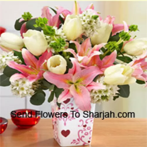 <b>Product Description</b><br><br>Pink Lilies And White Tulips With Assorted White Fillers In A Glass Vase - Please Note That In Case Of Non-Availability Of Certain Seasonal Flowers The Same Will Be Substituted With Other Flowers Of Same Value<br><br><b>Delivery Information</b><br><br>* The design and packaging of the product can always vary and is subject to the availability of flowers and other products available at the time of delivery.<br><br>* The "Time selected is treated as a preference/request and is not a fixed time for delivery". We only guarantee delivery on a "Specified Date" and not within a specified "Time Frame".
