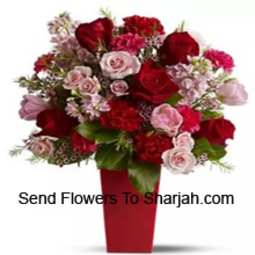 <b>Product Description</b><br><br>Red Roses, Red Carnations And Pink Roses With Seasonal Fillers In A Glass Vase -- 24 Stems And Fillers<br><br><b>Delivery Information</b><br><br>* The design and packaging of the product can always vary and is subject to the availability of flowers and other products available at the time of delivery.<br><br>* The "Time selected is treated as a preference/request and is not a fixed time for delivery". We only guarantee delivery on a "Specified Date" and not within a specified "Time Frame".