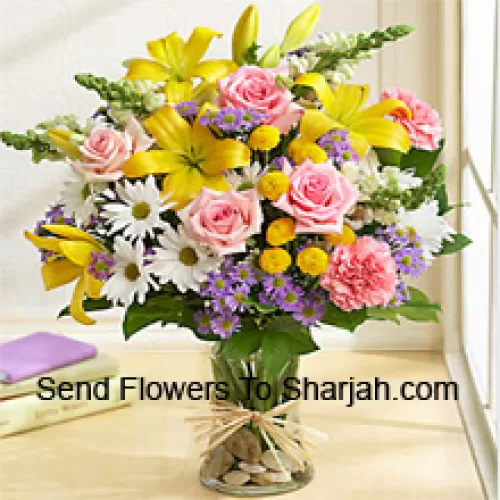 <b>Product Description</b><br><br>Pink Roses, Pink Carnations, White Gerberas And Yellow Lilies With Seasonal Fillers In A Glass Vase<br><br><b>Delivery Information</b><br><br>* The design and packaging of the product can always vary and is subject to the availability of flowers and other products available at the time of delivery.<br><br>* The "Time selected is treated as a preference/request and is not a fixed time for delivery". We only guarantee delivery on a "Specified Date" and not within a specified "Time Frame".