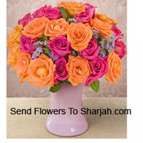 <b>Product Description</b><br><br>12 Pink And 12 Orange Roses With Seasonal Fillers In A Glass Vase<br><br><b>Delivery Information</b><br><br>* The design and packaging of the product can always vary and is subject to the availability of flowers and other products available at the time of delivery.<br><br>* The "Time selected is treated as a preference/request and is not a fixed time for delivery". We only guarantee delivery on a "Specified Date" and not within a specified "Time Frame".
