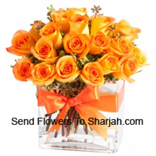 <b>Product Description</b><br><br>24 Orange Roses With Some Ferns In A Glass Vase<br><br><b>Delivery Information</b><br><br>* The design and packaging of the product can always vary and is subject to the availability of flowers and other products available at the time of delivery.<br><br>* The "Time selected is treated as a preference/request and is not a fixed time for delivery". We only guarantee delivery on a "Specified Date" and not within a specified "Time Frame".