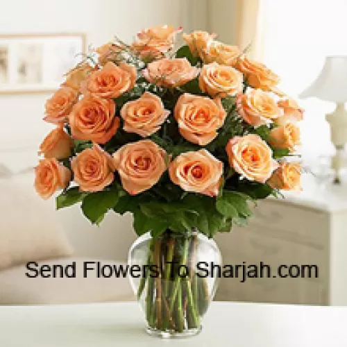 <b>Product Description</b><br><br>24 Peach Roses With Some Ferns In A Glass Vase<br><br><b>Delivery Information</b><br><br>* The design and packaging of the product can always vary and is subject to the availability of flowers and other products available at the time of delivery.<br><br>* The "Time selected is treated as a preference/request and is not a fixed time for delivery". We only guarantee delivery on a "Specified Date" and not within a specified "Time Frame".