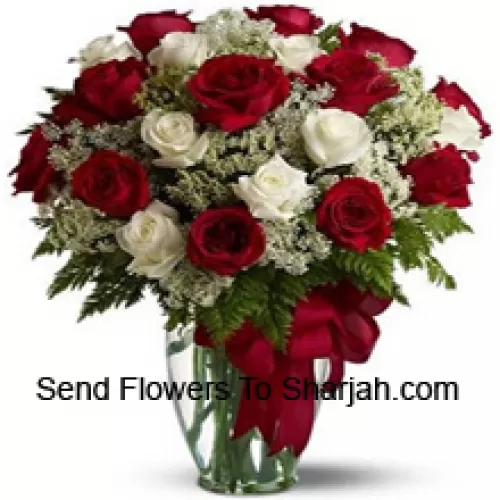 <b>Product Description</b><br><br>12 Red And 12 White Roses With Some Ferns In A Glass Vase<br><br><b>Delivery Information</b><br><br>* The design and packaging of the product can always vary and is subject to the availability of flowers and other products available at the time of delivery.<br><br>* The "Time selected is treated as a preference/request and is not a fixed time for delivery". We only guarantee delivery on a "Specified Date" and not within a specified "Time Frame".