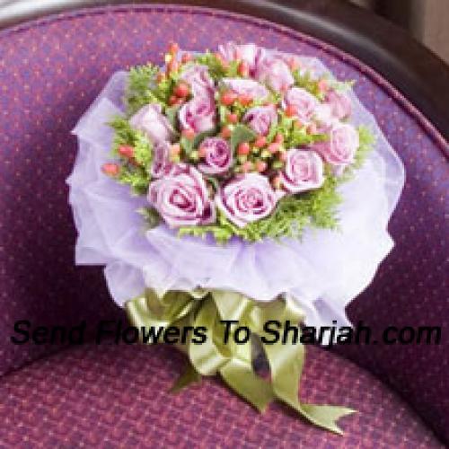 12 Light Pink Wrapped Roses