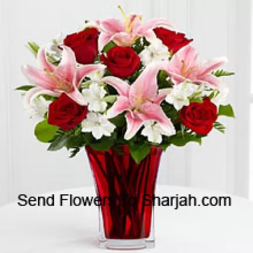 <b>Product Description</b><br><br>6 Red Roses And 5 Pink Lilies With Seasonal Fillers In A Beautiful Glass Vase<br><br><b>Delivery Information</b><br><br>* The design and packaging of the product can always vary and is subject to the availability of flowers and other products available at the time of delivery.<br><br>* The "Time selected is treated as a preference/request and is not a fixed time for delivery". We only guarantee delivery on a "Specified Date" and not within a specified "Time Frame".
