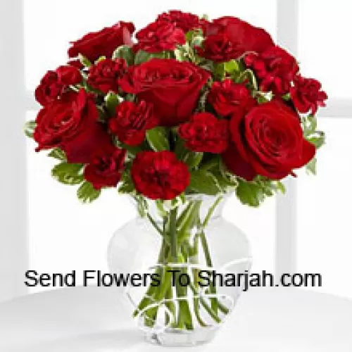 <b>Product Description</b><br><br>9 Red Roses And 9 Red Carnations In A Glass Vase<br><br><b>Delivery Information</b><br><br>* The design and packaging of the product can always vary and is subject to the availability of flowers and other products available at the time of delivery.<br><br>* The "Time selected is treated as a preference/request and is not a fixed time for delivery". We only guarantee delivery on a "Specified Date" and not within a specified "Time Frame".