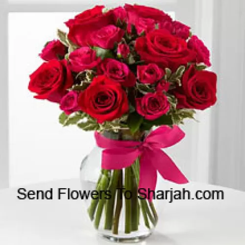 <b>Product Description</b><br><br>18 Red Roses With Seasonal Fillers In A Glass Vase Decorated With A Pink Bow<br><br><b>Delivery Information</b><br><br>* The design and packaging of the product can always vary and is subject to the availability of flowers and other products available at the time of delivery.<br><br>* The "Time selected is treated as a preference/request and is not a fixed time for delivery". We only guarantee delivery on a "Specified Date" and not within a specified "Time Frame".
