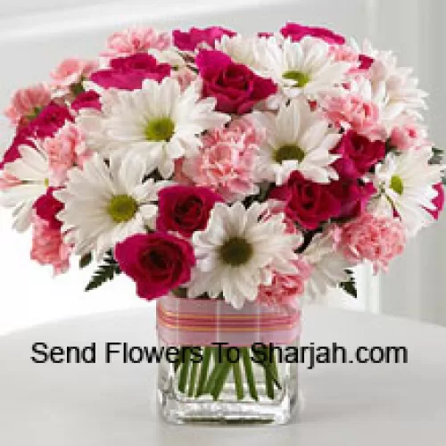 <b>Product Description</b><br><br>12 Red Roses, 12 White Daisies And 12 Pink Colored Carnations In A Glass Vase<br><br><b>Delivery Information</b><br><br>* The design and packaging of the product can always vary and is subject to the availability of flowers and other products available at the time of delivery.<br><br>* The "Time selected is treated as a preference/request and is not a fixed time for delivery". We only guarantee delivery on a "Specified Date" and not within a specified "Time Frame".