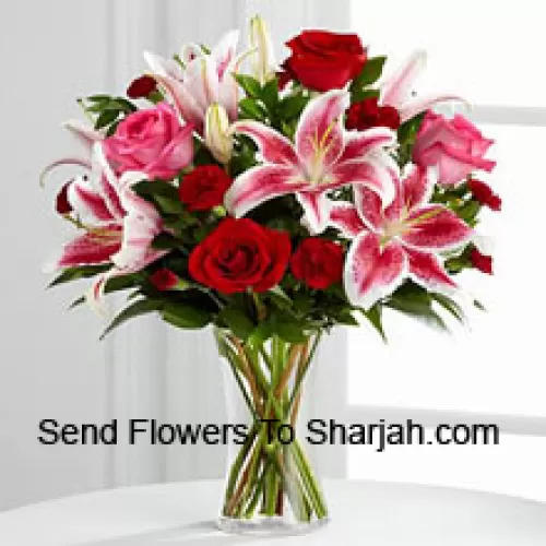 <b>Product Description</b><br><br>Red And Pink Roses With Pink Lilies And Seasonal Fillers In A Glass Vase<br><br><b>Delivery Information</b><br><br>* The design and packaging of the product can always vary and is subject to the availability of flowers and other products available at the time of delivery.<br><br>* The "Time selected is treated as a preference/request and is not a fixed time for delivery". We only guarantee delivery on a "Specified Date" and not within a specified "Time Frame".