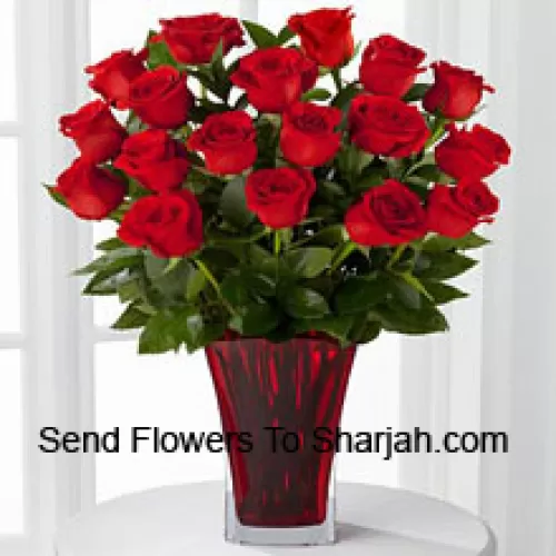 <b>Product Description</b><br><br>18 Red Roses With Seasonal Fillers In A Glass Vase Decorated With A Pink Bow<br><br><b>Delivery Information</b><br><br>* The design and packaging of the product can always vary and is subject to the availability of flowers and other products available at the time of delivery.<br><br>* The "Time selected is treated as a preference/request and is not a fixed time for delivery". We only guarantee delivery on a "Specified Date" and not within a specified "Time Frame".