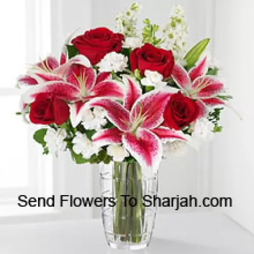 <b>Product Description</b><br><br>Red Roses, Pink Lilies With Assorted White Flowers In A Glass Vase<br><br><b>Delivery Information</b><br><br>* The design and packaging of the product can always vary and is subject to the availability of flowers and other products available at the time of delivery.<br><br>* The "Time selected is treated as a preference/request and is not a fixed time for delivery". We only guarantee delivery on a "Specified Date" and not within a specified "Time Frame".