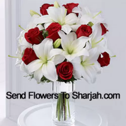 This product is a sleek and elegant way to spread goodwill for the holiday season. Red roses are set to catch the eye arranged amongst white Oriental lilies in a clear glass cylinder vase wrapped in silver ribbon to create a seasonal display of heartfelt wishes for a magical holiday. (Please Note That We Reserve The Right To Substitute Any Product With A Suitable Product Of Equal Value In Case Of Non-Availability Of A Certain Product)