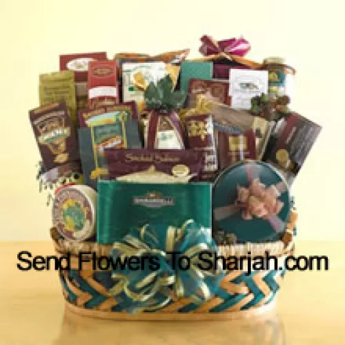 This enormous gift basket is an over-the-top EID gift that is sure to leave a grand impression! When you need to send something that is truly memorable and is large enough to be enjoyed by a crowd, this gift basket is perfect. This sweet and savory selection features smoked salmon, crackers, cheese, assorted nuts, biscotti, Bavarian-style pretzels, cheese sticks, tortilla chips, salsa, cheese swirls, snack mix, a collection of cookies, caramel popcorn, Ghirardelli chocolate squares, a box of assorted Ghirardelli chocolates, a tin of chocolate-covered sandwich cookies, chocolate-dipped pretzels, chocolate nuggets, and hot cocoa mix. They won't know what to eat first! (Please Note That We Reserve The Right To Substitute Any Product With A Suitable Product Of Equal Value In Case Of Non-Availability Of A Certain Product)